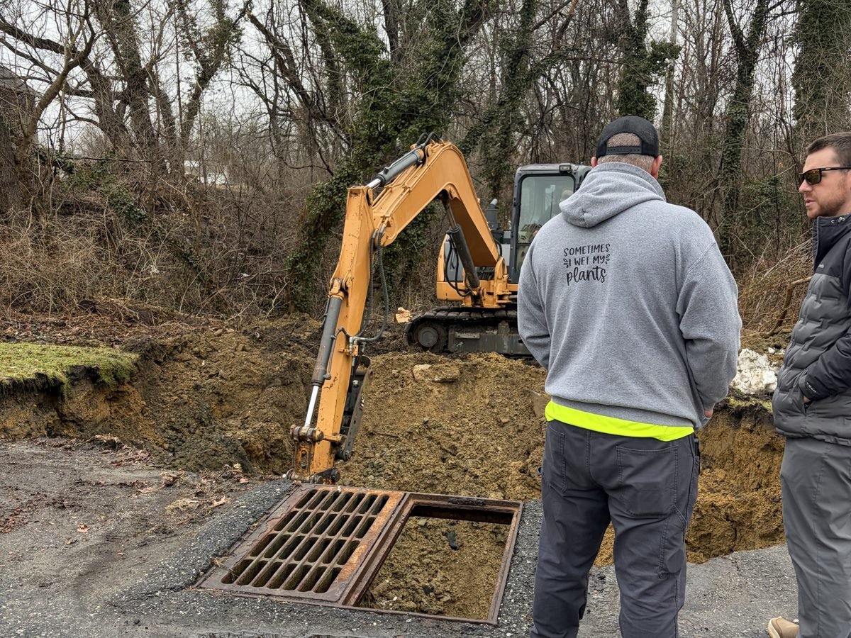 ETS engineers inspecting a stormwater drainage structure