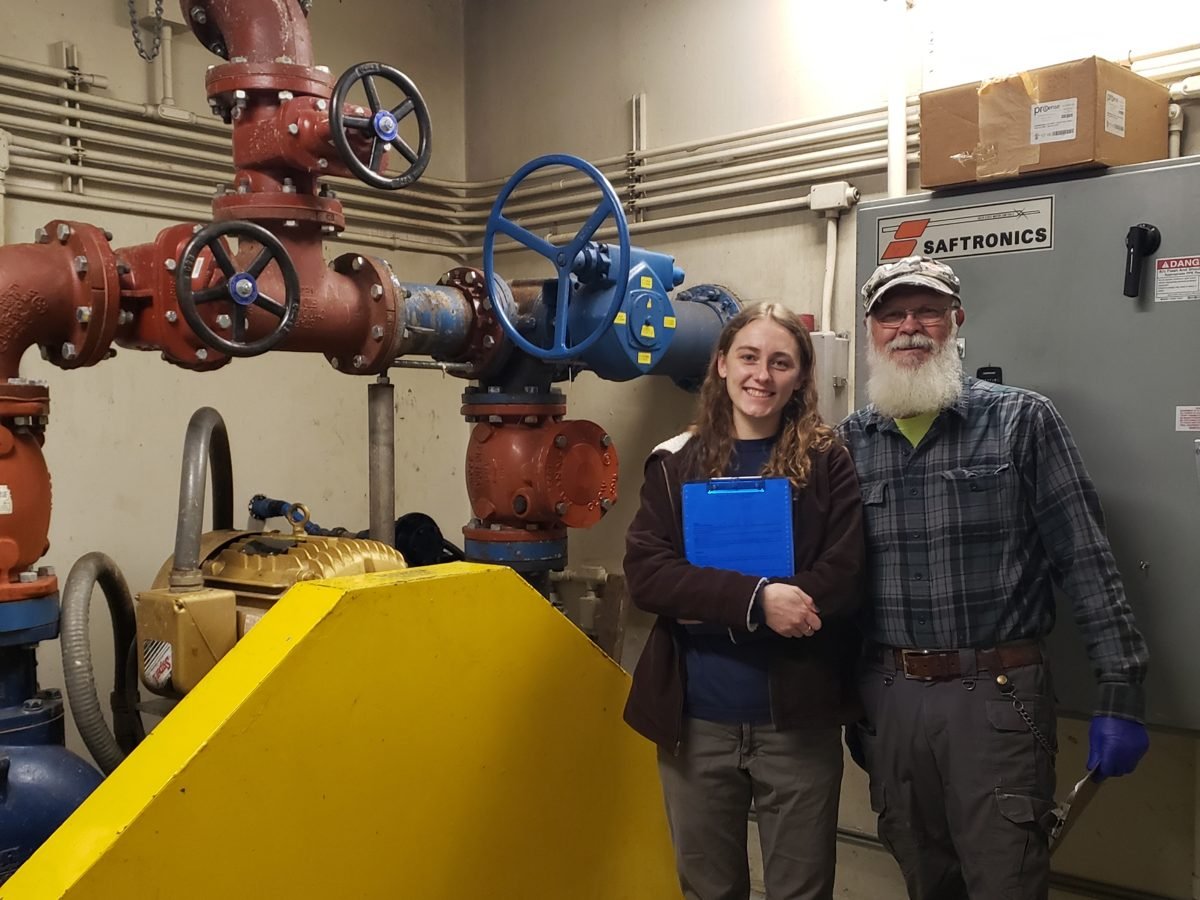 ETS staff at a pump station with control valves